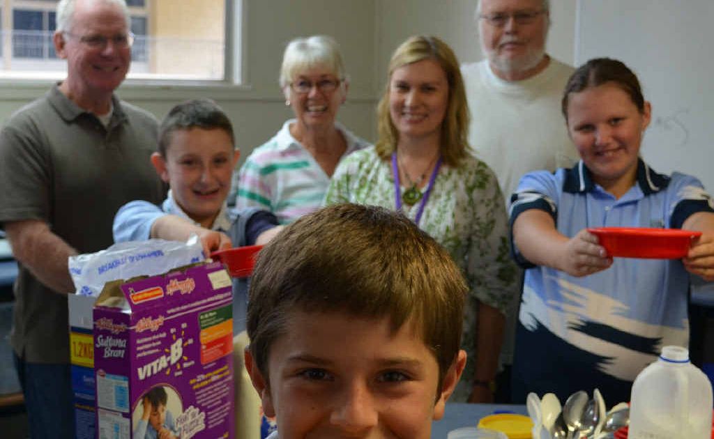 (Back from left) Volunteers Peter Campbell, Betty Connelly and Mick McEniery, (middle) student Dylan Ready, school chaplain Donna Angell, students Lisa-Marie Henry and (front) Dawson Wright enjoy the breakfast club.